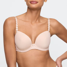 Load image into Gallery viewer, Caffé Latte formed plunge underwired bra. The shoulder straps have a playful circular design which can be converted into a halter style. The formed smooth finish of the cup is perfect under T/Shirts. Deep plunge offering invisibility under many outfits!
Fabric Content: Polyester: 36%, Polyamide: 38%, Elastane: 26%