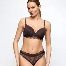 Load image into Gallery viewer, Woman wearing a black lace lingerie set on a white background