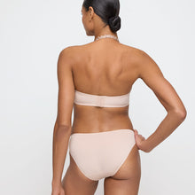 Load image into Gallery viewer, Caffé Latte formed plunge underwired bra. The shoulder straps have a playful circular design which can be converted into a halter style. The formed smooth finish of the cup is perfect under T/Shirts. Deep plunge offering invisibility under many outfits!
Fabric Content: Polyester: 36%, Polyamide: 38%, Elastane: 26%