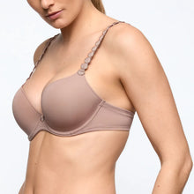 Load image into Gallery viewer, Woman wearing a beige bra on a plain background