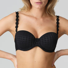 Load image into Gallery viewer, Black strapless formed cup underwire bra with a balconnet line. Straight back with silicone strip to give extra support when the bra is worn strapless. Excellent shape and support for those strapless occasions. May also be worn in a halter style. The signature daisy straps complete the picture! Fabric Content: Polyamide: 49%, Polyester: 41%, Elastane: 10%