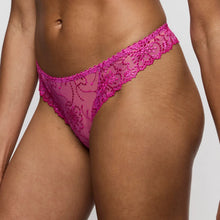 Load image into Gallery viewer, Pink lace thong worn by a person on a plain background