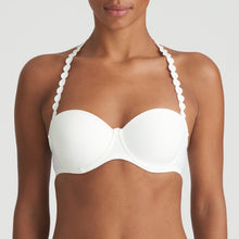Load image into Gallery viewer, Ivory strapless balconnet underwired bra. The shoulder straps have a playful circular design which can be converted into a halter style. The formed smooth finish of the cup is perfect under T/Shirts. Perfect for strapless or normal wear. Fabric Content: Polyamide: 39%, Polyester: 35%, Elastane: 26%