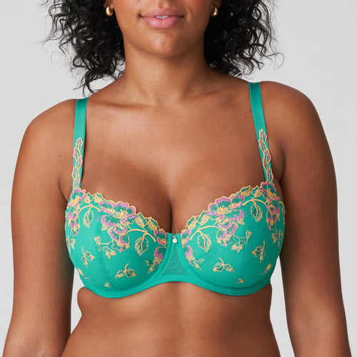 Lenca is a stylish balconnet bra with a pre-formed cup and allover embroidery. The straps are decorated with luxurious guipure lace, with a pearl at the centre-front. The embroidered trim at the tops of the cups ensures that the bra fits seamlessly around the bust. Sunny Teal is a tropical shade of green with ochre and fuchsia highlights. It looks great on both pale and dark skin.  Fabric content: Polyester: 49%, Polyamide: 41%, Elastane:10%