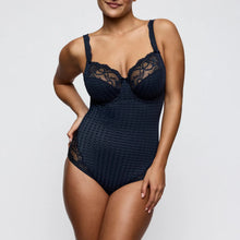 Load image into Gallery viewer, Woman wearing a navy blue lace lingerie set on a light gray background