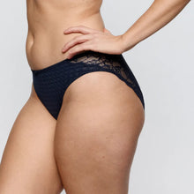 Load image into Gallery viewer, Navy lace underwear worn by a person on a plain background
