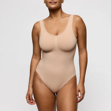 Load image into Gallery viewer, Beige bodysuit worn by a model on a white background