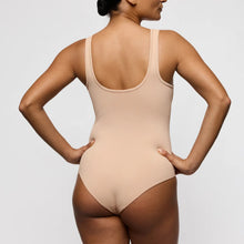Load image into Gallery viewer, Beige bodysuit worn by a person on a plain background