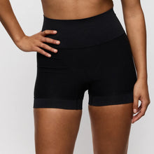Load image into Gallery viewer, Person wearing black athletic shorts on a plain background