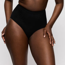 Load image into Gallery viewer, Person wearing black high-waisted bikini bottoms on a plain background