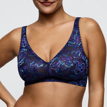 Load image into Gallery viewer, Blue floral lace bra on a model against a neutral background