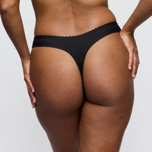 Load image into Gallery viewer, Person wearing black underwear on a plain background