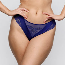 Load image into Gallery viewer, Blue lace underwear worn by a person on a plain background