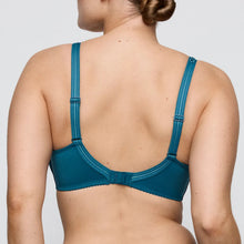 Load image into Gallery viewer, Blue bra worn by a person on a plain background