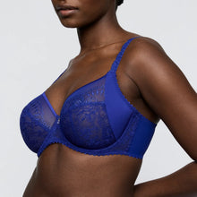 Load image into Gallery viewer, Blue lace bra worn by a model on a plain background