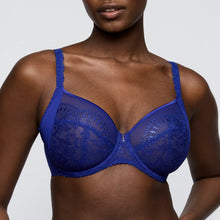 Load image into Gallery viewer, Blue lace bra worn by a model on a plain background