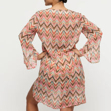 Load image into Gallery viewer, Woman wearing a colorful zigzag pattern dress on a white background