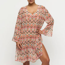 Load image into Gallery viewer, Woman wearing a colorful zigzag patterned dress on a white background