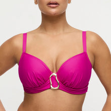 Load image into Gallery viewer, Woman wearing a bright pink bikini top with a gold clasp on a light gray background