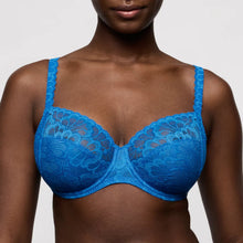 Load image into Gallery viewer, Blue lace bra worn by a model on a plain background