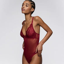 Load image into Gallery viewer, Woman wearing a red lace lingerie set against a plain background