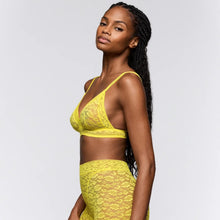 Load image into Gallery viewer, Woman wearing a yellow lace lingerie set on a white background