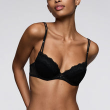 Load image into Gallery viewer, Black bra worn by a model on a plain background