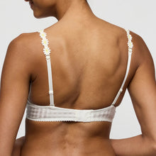 Load image into Gallery viewer, White bra with floral straps worn by a model on a plain background
