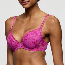 Load image into Gallery viewer, Pink lace bra worn by a model on a plain background