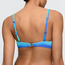 Load image into Gallery viewer, Blue bikini top worn by a person on a plain background