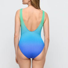 Load image into Gallery viewer, Woman wearing a gradient blue and green swimsuit on a plain background