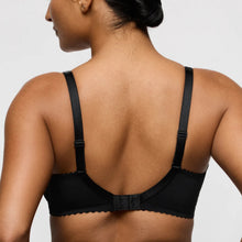 Load image into Gallery viewer, Black bra worn by a person on a light gray background