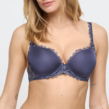 Load image into Gallery viewer, Navy blue bra with lace details worn by a model on a white background