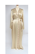 Load image into Gallery viewer, Beautiful full length dressing gown in pure silk satin in a collarless kimono style. It has 2 side pockets and belted at the waist. The appliqué lace runs the entire length of the wrapover section of the robe. This is a classic style, with clean simple lines but with an added touch of luxury with its lace detailing. Fabric Content: 100% Pure Silk Made in Italy Machine washable.