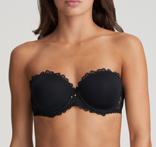 Load image into Gallery viewer, This is the attractive end of the strapless bra market. Beautifully smooth to the front but with a delicate lace trim on the cup to counterbalance any severity. The removable straps, if worn, are dainty and lace trimmed. This bra has the added bonus to create the halter style also. Fabric content: Polyamide: 53%, Polyester: 35%, Elastane: 12%. Black.
