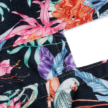 Load image into Gallery viewer, This is a beautiful corset made the French way. It has a square neckline at the front with pearl encrusted embellishment detail around its edges. The clever hidden boning and panelling that draws in the waist and supports the bust. The jolly Parrot pattern on a black ground continues around the back. where there is a centred zip. This is a stunning garment. It is perfect for outwear.