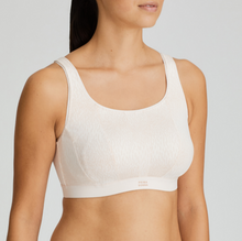 Load image into Gallery viewer, Fantastically supportive Non-Wire bra. It offers versatile support and extreme comfort. Adjustable straps, with hooks and eyes. The delicate printed cups and straps have a cross-back or straight option. Three-part cup for extra support. Padded straps and closure. No irritation seamless cup. Anti-chafing super soft elastic banding. The performance fabric uses highly breathable technology to keep you cool, fresh and dry. Wash at 30°C Polyamide:51%, Polyester:32%, Elastane:17%