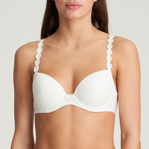 BEST SELLER!  Formed cup, deep plunge underwired smooth bra. It supports the bust and gives a beautiful shape while offering a feminine, plunge effect. The signature daisy straps complete the picture!  Fabric Content: Polyester: 48%, Polyamide: 43%, Elastane: 9%