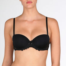 Load image into Gallery viewer, Jane formed and seamless cupped bra with the seductive balconnet neckline. Smooth opaque cups with floral lace trim. The wider wire ensures optimal comfort. Lifts the bust, creating a natural image. Perfect for multiple necklines. B to F cup. Fabric content: Polyamide: 66%, Polyester: 26%, Elastane: 8%. Black.
