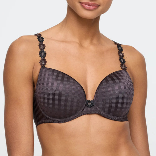 Black patterned bra worn by a model on a white background