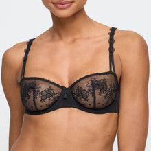 Load image into Gallery viewer, Black lace bra worn by a model on a plain background

