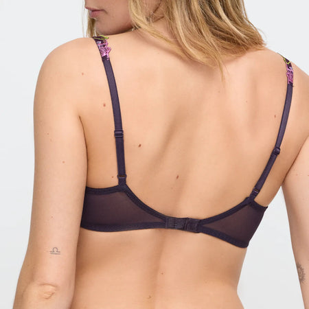 Navy blue bra with thin straps on a plain background