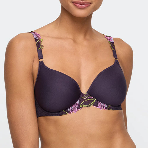 Navy blue bra with floral straps worn by a model on a white background