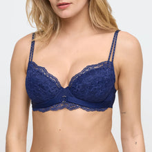 Load image into Gallery viewer, Navy blue lace bra worn by a model on a white background
