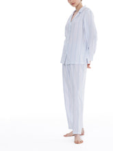Load image into Gallery viewer, Blue stripe on a white ground, in 100% cashmere soft cotton flannel. Buttoned at the front with a revere collar. Full length trouser with a soft elasticated waist. Perfect for sleeping or lounging.  Celestine nightwear, dressing gowns, short robes and pyjamas drop from the shoulder, therefore one size fits all.  Fabric composition: 100% Cotton Flannel. Made in Germany. Machine Washable.

