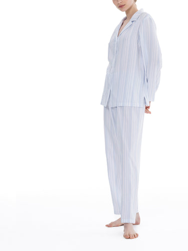 Blue stripe on a white ground, in 100% cashmere soft cotton flannel. Buttoned at the front with a revere collar. Full length trouser with a soft elasticated waist. Perfect for sleeping or lounging.  Celestine nightwear, dressing gowns, short robes and pyjamas drop from the shoulder, therefore one size fits all.  Fabric composition: 100% Cotton Flannel. Made in Germany. Machine Washable.
