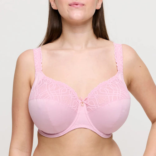 Pink bra worn by a model on a light gray background
