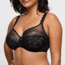 Load image into Gallery viewer, Black lace bra worn by a model on a plain background
