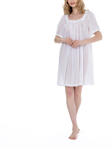 White Very beautiful short (95cm) short sleeve nightgown. Lace details on square neck and sleeve hem. Flared skirt for ease of movement when sleeping. Made in Germany from the finest pure Swiss cotton, Celestine nightdresses are diaphanous, offering perfect sleep without heaviness. Celestine nightwear, dressing gowns and short robes drop from the shoulder, therefore one size fits all.  Fabric composition:  100% Pure Swiss Cotton. 100% Guipure Cotton Lace. Machine Washable.