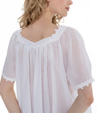 Load image into Gallery viewer, White Very beautiful short (95cm) short sleeve nightgown. Lace details on square neck and sleeve hem. Flared skirt for ease of movement when sleeping. Made in Germany from the finest pure Swiss cotton, Celestine nightdresses are diaphanous, offering perfect sleep without heaviness. Celestine nightwear, dressing gowns and short robes drop from the shoulder, therefore one size fits all.  Fabric composition:  100% Pure Swiss Cotton. 100% Guipure Cotton Lace. Machine Washable.
